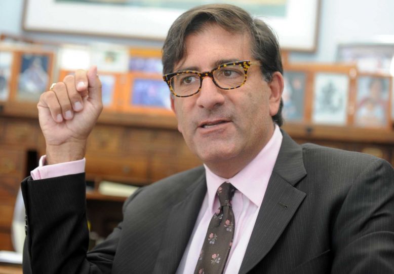 Headshot of Dr. Andrew Bazos while he is speaking.